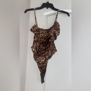A small cheetah onesie! Velvet material